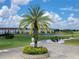 Landscaped entrance to the community with golf course view at 2185 Victoria Dr, Davenport, FL 33837