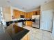 Kitchen boasts stainless steel appliances and granite countertops at 2185 Victoria Dr, Davenport, FL 33837