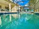 Refreshing screened-in pool with plenty of sunlight at 2185 Victoria Dr, Davenport, FL 33837