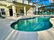 Inviting kidney-shaped pool with screened enclosure at 2185 Victoria Dr, Davenport, FL 33837