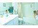 Bright bathroom with modern fixtures, a shower-tub combo, and stylish decor at 2202 Margarita Dr, The Villages, FL 32159