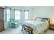 Bright bedroom with two large windows and quaint furnishings at 2202 Margarita Dr, The Villages, FL 32159