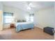 Tranquil bedroom with tiled floors, vaulted ceilings, and lots of natural light at 2202 Margarita Dr, The Villages, FL 32159