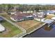 Aerial view of single-story home with canal access and fenced backyard at 28228 Tammi Dr, Tavares, FL 32778