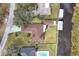 Bird's-eye view of house, yard, pool, and canal at 28228 Tammi Dr, Tavares, FL 32778