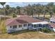 Backyard view of house with deck and screened porch at 28228 Tammi Dr, Tavares, FL 32778