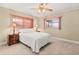 Bedroom with a queen bed and ceiling fan at 28228 Tammi Dr, Tavares, FL 32778