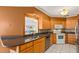 Kitchen with granite countertops and oak cabinets at 28228 Tammi Dr, Tavares, FL 32778