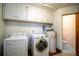 Laundry room with washer, dryer, and toilet at 28228 Tammi Dr, Tavares, FL 32778