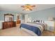 Main bedroom with king-size bed and ensuite bathroom at 28228 Tammi Dr, Tavares, FL 32778