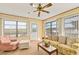 Sunroom with comfy seating and backyard view at 28228 Tammi Dr, Tavares, FL 32778