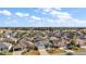 Aerial view of a residential neighborhood with many homes at 3257 Kilarny Pl, The Villages, FL 32163