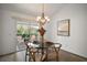 Bright dining area with glass table and access to a screened porch at 3257 Kilarny Pl, The Villages, FL 32163