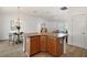 Large kitchen island with additional seating and storage at 3257 Kilarny Pl, The Villages, FL 32163