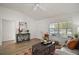 Spacious living room featuring hardwood floors and large windows at 3257 Kilarny Pl, The Villages, FL 32163