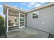 Screened porch with ceiling fan and concrete flooring at 3257 Kilarny Pl, The Villages, FL 32163