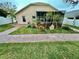 Brick paved pathway leads to a home with a screened patio at 33304 Kaylee Way, Leesburg, FL 34788