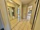 Bathroom with mirrored closet doors and tile flooring at 33304 Kaylee Way, Leesburg, FL 34788