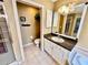 Bathroom with vanity, toilet, and tiled flooring at 33304 Kaylee Way, Leesburg, FL 34788