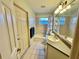 Clean bathroom with tub, vanity, and updated fixtures at 33304 Kaylee Way, Leesburg, FL 34788