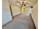 Bright bedroom featuring carpet flooring and ceiling fan at 33304 Kaylee Way, Leesburg, FL 34788