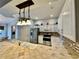 Kitchen boasts stainless steel appliances and an island at 33304 Kaylee Way, Leesburg, FL 34788