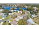 Aerial view of community, showing a cluster of houses near a lake at 33352 Fountain Ln, Leesburg, FL 34788