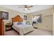 Spacious bedroom with a queen-size bed and wood headboard at 33352 Fountain Ln, Leesburg, FL 34788