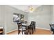 Dining area with dark wood table and six chairs at 33352 Fountain Ln, Leesburg, FL 34788