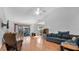Bright living room with hardwood floors, vaulted ceiling, and comfortable furnishings at 33352 Fountain Ln, Leesburg, FL 34788