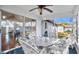 Bright screened porch with view of backyard and ceiling fan at 33352 Fountain Ln, Leesburg, FL 34788