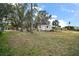 Large backyard with shed and mature trees at 34245 Rosa Ln, Fruitland Park, FL 34731