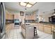 Spacious kitchen featuring granite countertops, island, and stainless steel appliances at 34245 Rosa Ln, Fruitland Park, FL 34731