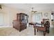 Living room with tile flooring, ceiling fan, and plenty of natural light at 34245 Rosa Ln, Fruitland Park, FL 34731