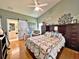 Main bedroom with ceiling fan and ensuite bathroom access at 3570 Rollingbrook St, Clermont, FL 34711