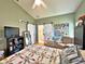 Main bedroom with barn door and ensuite bathroom at 3570 Rollingbrook St, Clermont, FL 34711