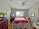 Guest bedroom with ceiling fan and hardwood floors at 3570 Rollingbrook St, Clermont, FL 34711