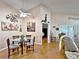 Bright dining area with hardwood floors and a view to the living room at 3570 Rollingbrook St, Clermont, FL 34711