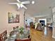 Round glass dining table with view into living room at 3570 Rollingbrook St, Clermont, FL 34711