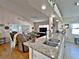 Kitchen with granite countertops, stainless steel sink, and view to living room at 3570 Rollingbrook St, Clermont, FL 34711