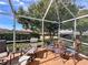 Spacious screened-in porch with seating area, perfect for outdoor enjoyment at 3570 Rollingbrook St, Clermont, FL 34711