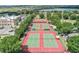 Aerial view of community tennis courts, perfect for recreation at 3570 Rollingbrook St, Clermont, FL 34711