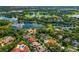 Aerial view of community with lake and lush landscape at 365 N Spaulding Cv, Lake Mary, FL 32746