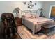 Relaxing Primary bedroom with king-size bed and massage chair at 365 N Spaulding Cv, Lake Mary, FL 32746