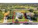 Aerial view of a two-story house in a residential neighborhood at 3898 Beacon Ridge Way, Clermont, FL 34711