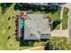 Aerial view showcasing the home's layout, pool, and surrounding landscape at 3898 Beacon Ridge Way, Clermont, FL 34711