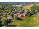 Aerial view of house with pool and large backyard, situated in a quiet neighborhood at 3898 Beacon Ridge Way, Clermont, FL 34711