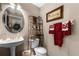 Charming powder room with decorative accents at 3898 Beacon Ridge Way, Clermont, FL 34711