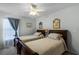 Cozy bedroom with two twin beds and beach-themed decor at 3898 Beacon Ridge Way, Clermont, FL 34711