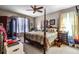 Bright bedroom featuring a comfortable bed and large windows at 3898 Beacon Ridge Way, Clermont, FL 34711